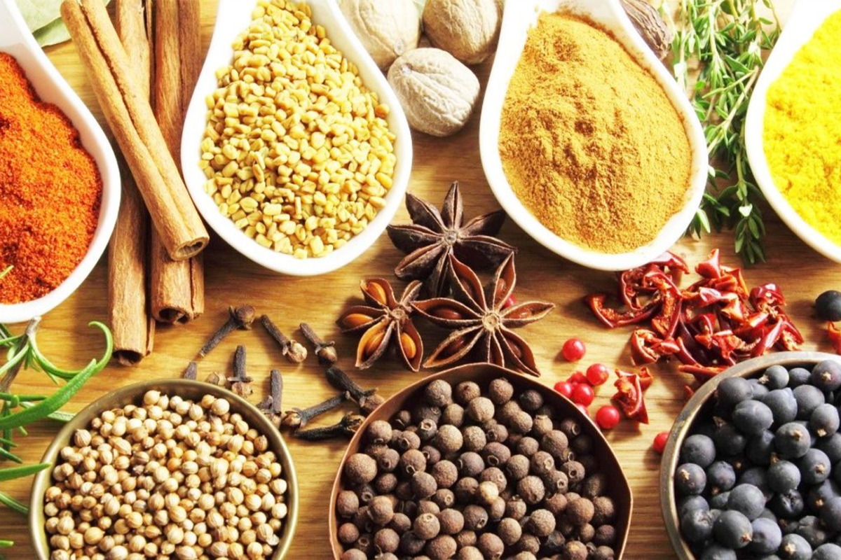 Pakistani meal with fresh herbs, lemon, garlic, and spices – ways to reduce salt intake for heart health – Hamza The Dietitian